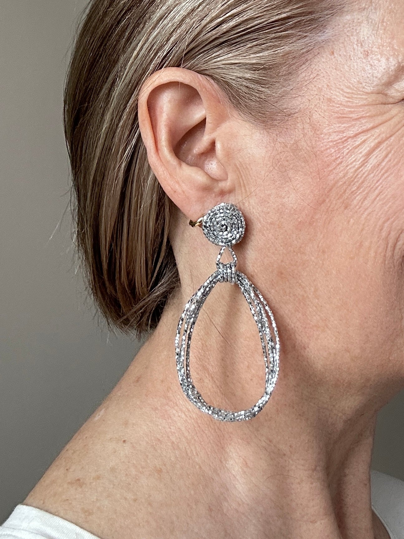 Silver beaded cord loop earrings